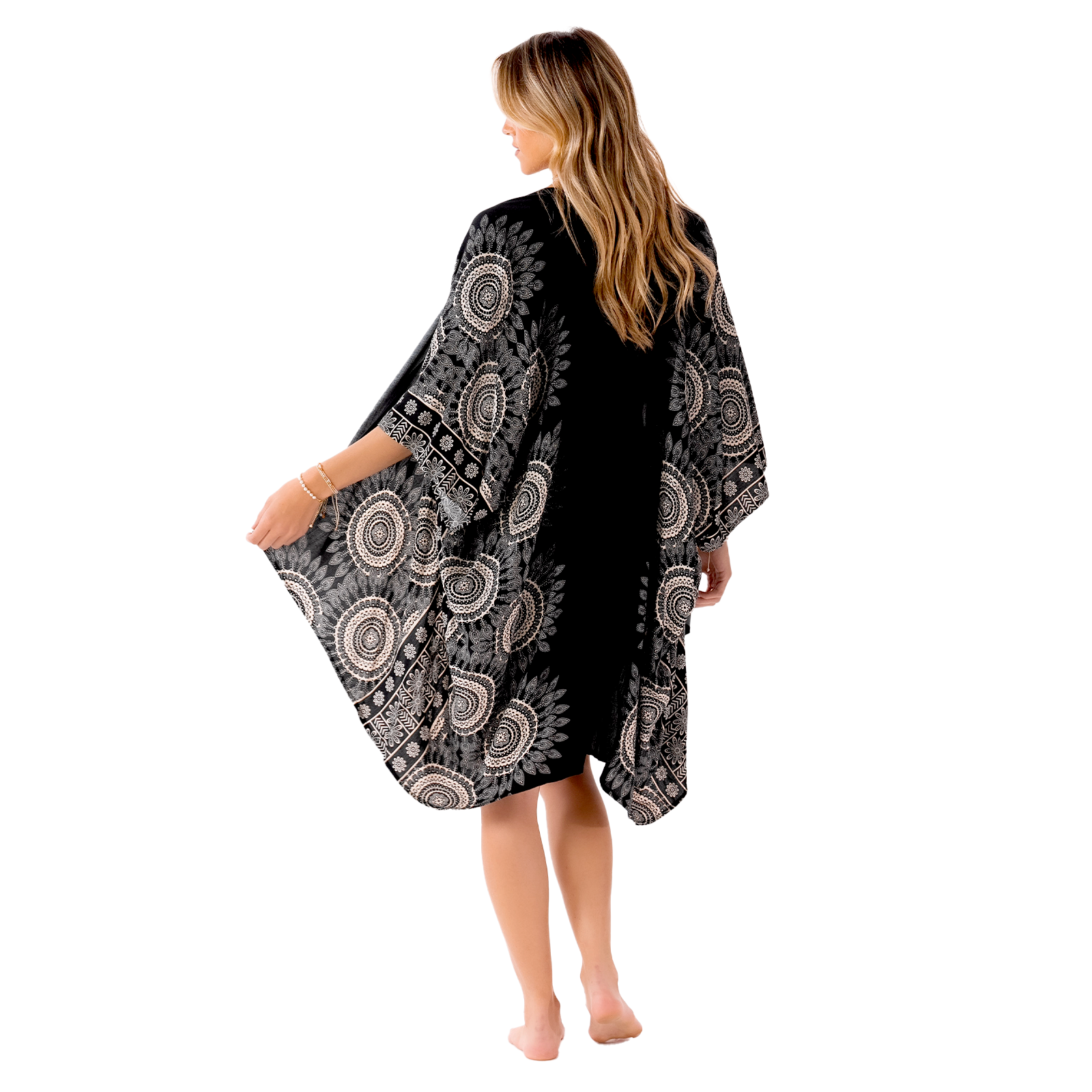 Model wearing a lounge set consisting of black and cream mandala print harem pants and a matching kimono.