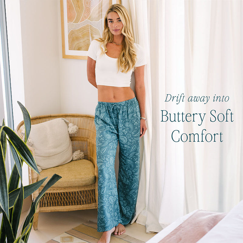 Pacific Paisley Drift Pants, worn indoors with quote overlay