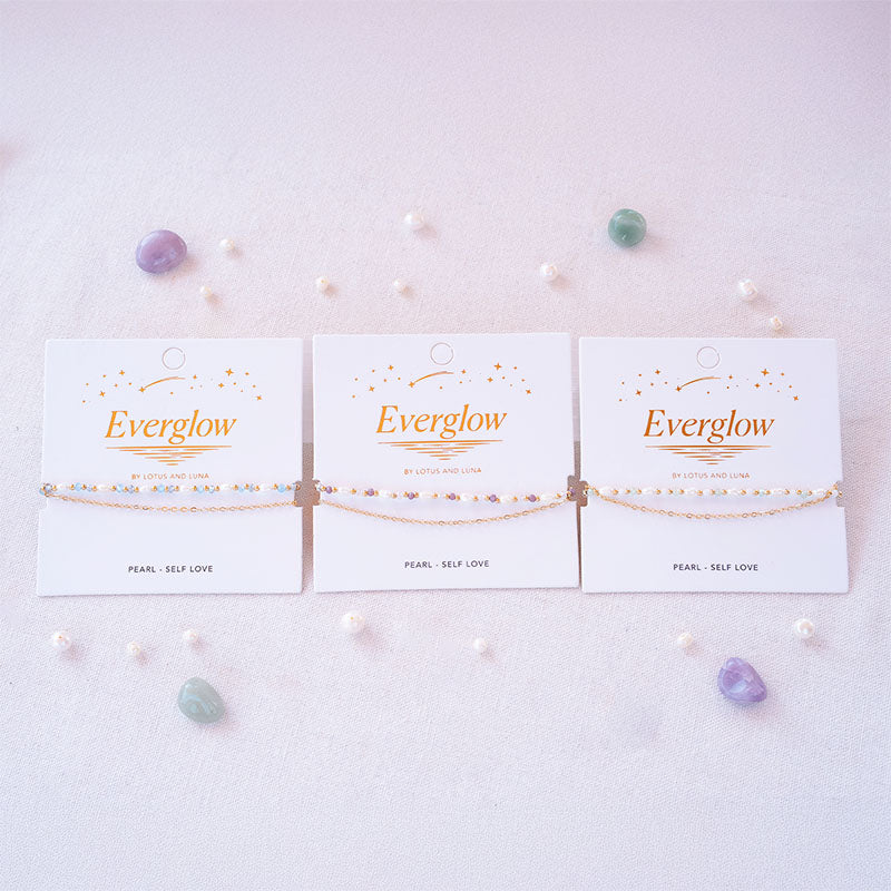 Everglow Pearl Bracelets collection, flat lay on cards