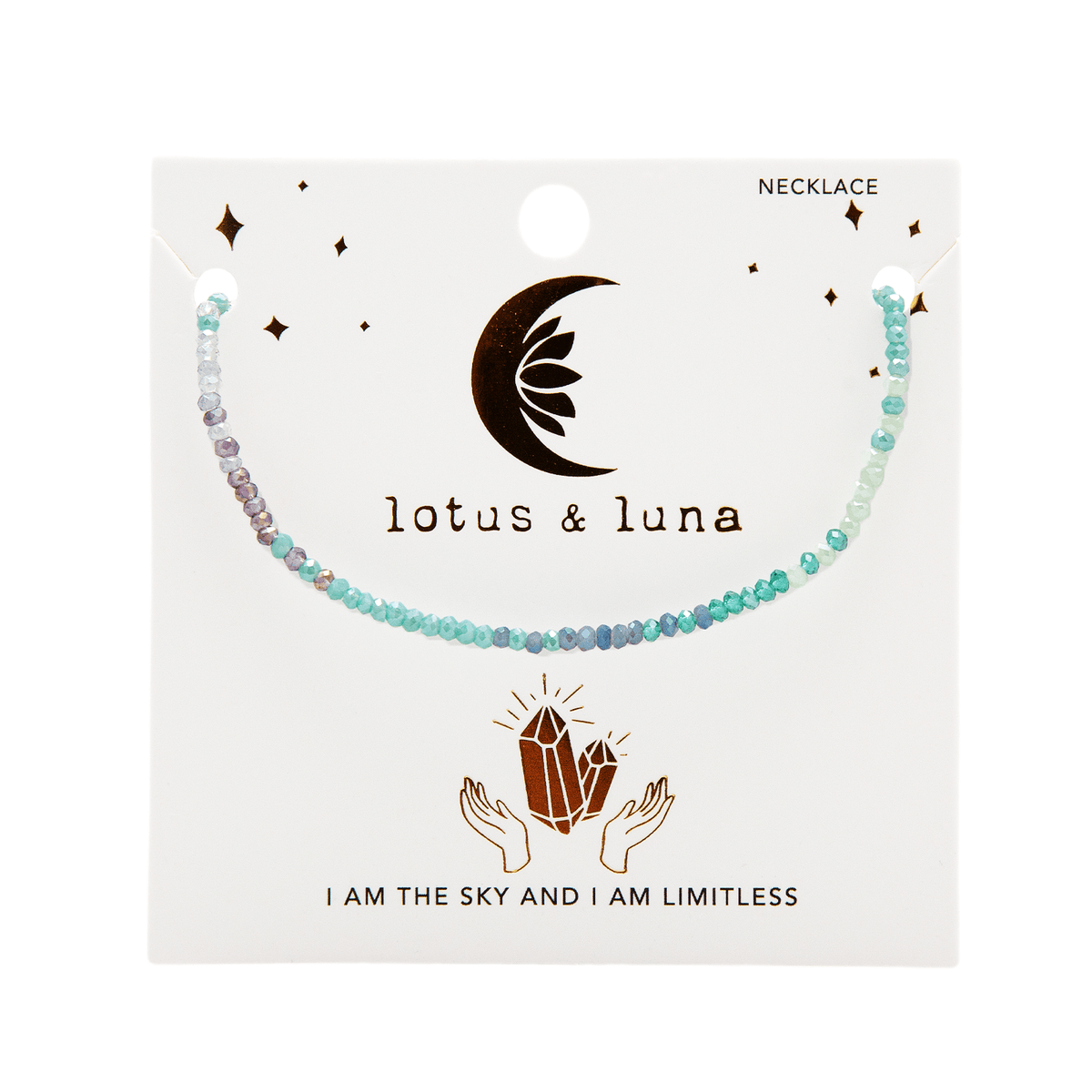 Teal, blue and purple stone goddess necklace on packaging