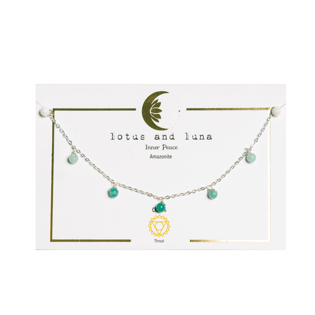 Silver chain necklace with green stone dewdrop charms on packaging