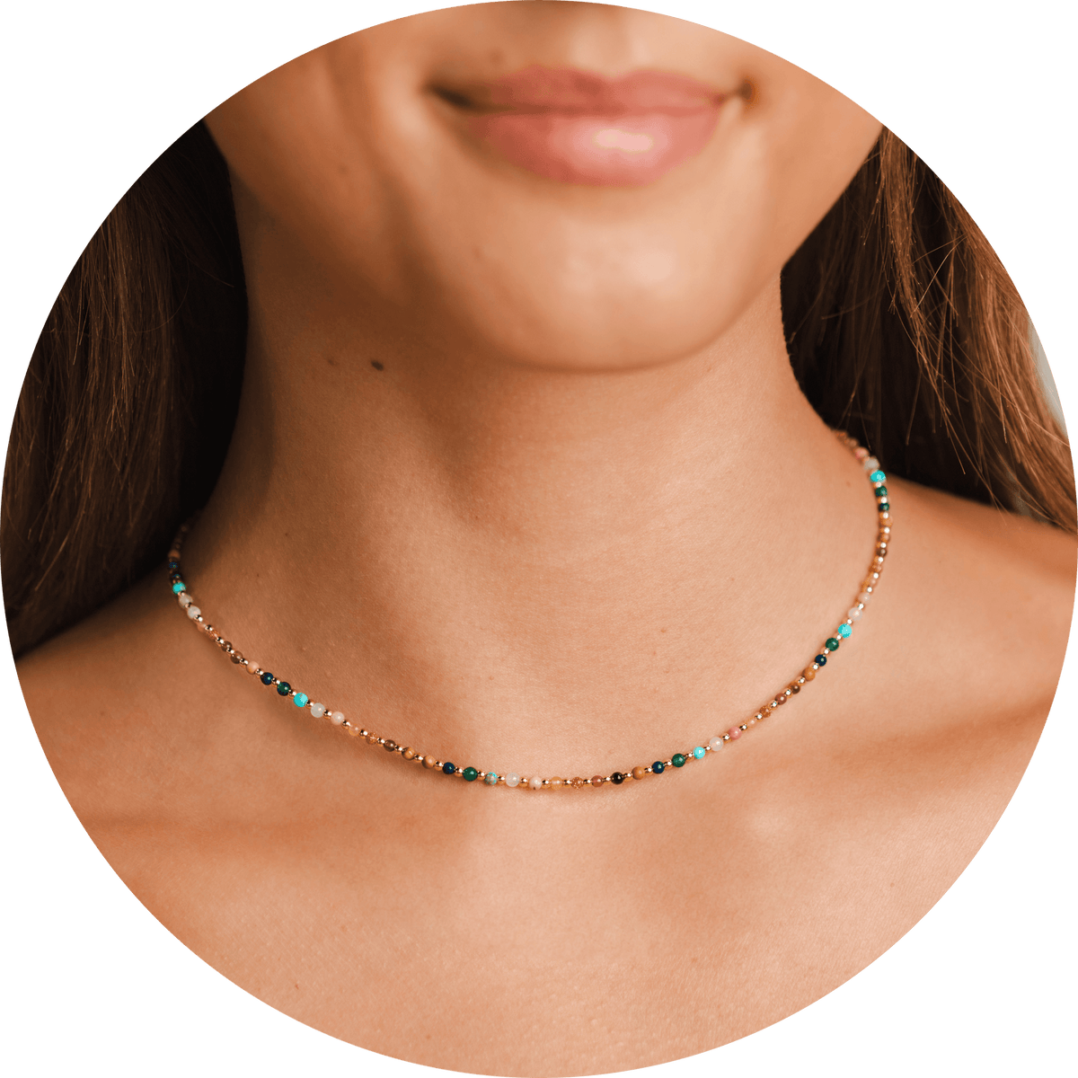 Model wearing a 2mm multicolor and gold bead healing necklace