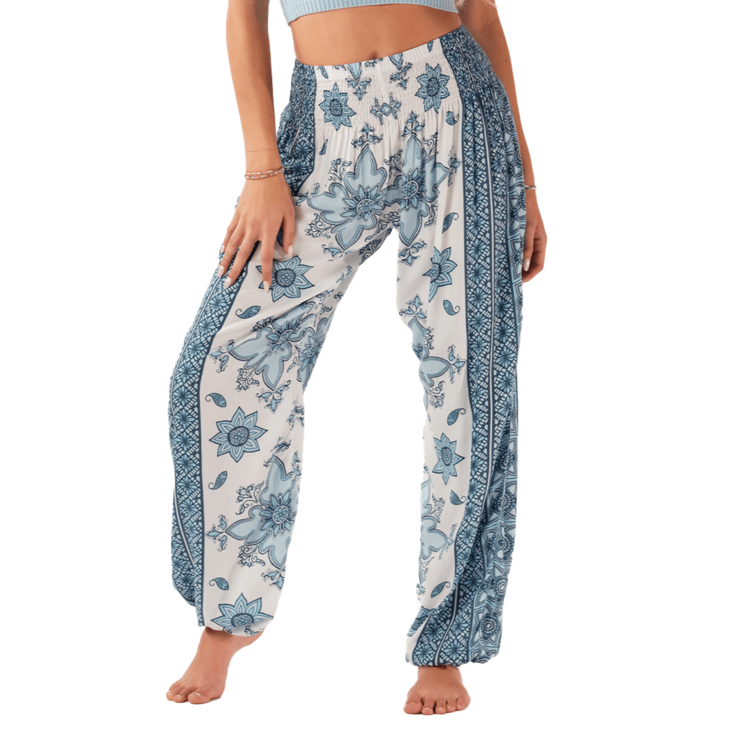 Model wearing blue and white harem pants with a tile pattern
